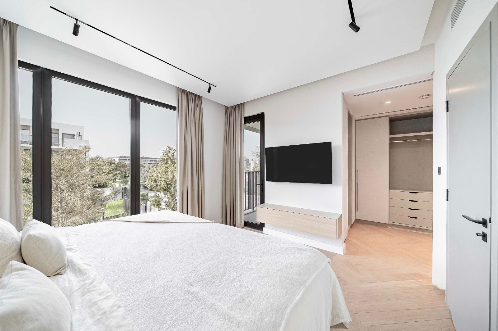 Master bedroom with soft white palette