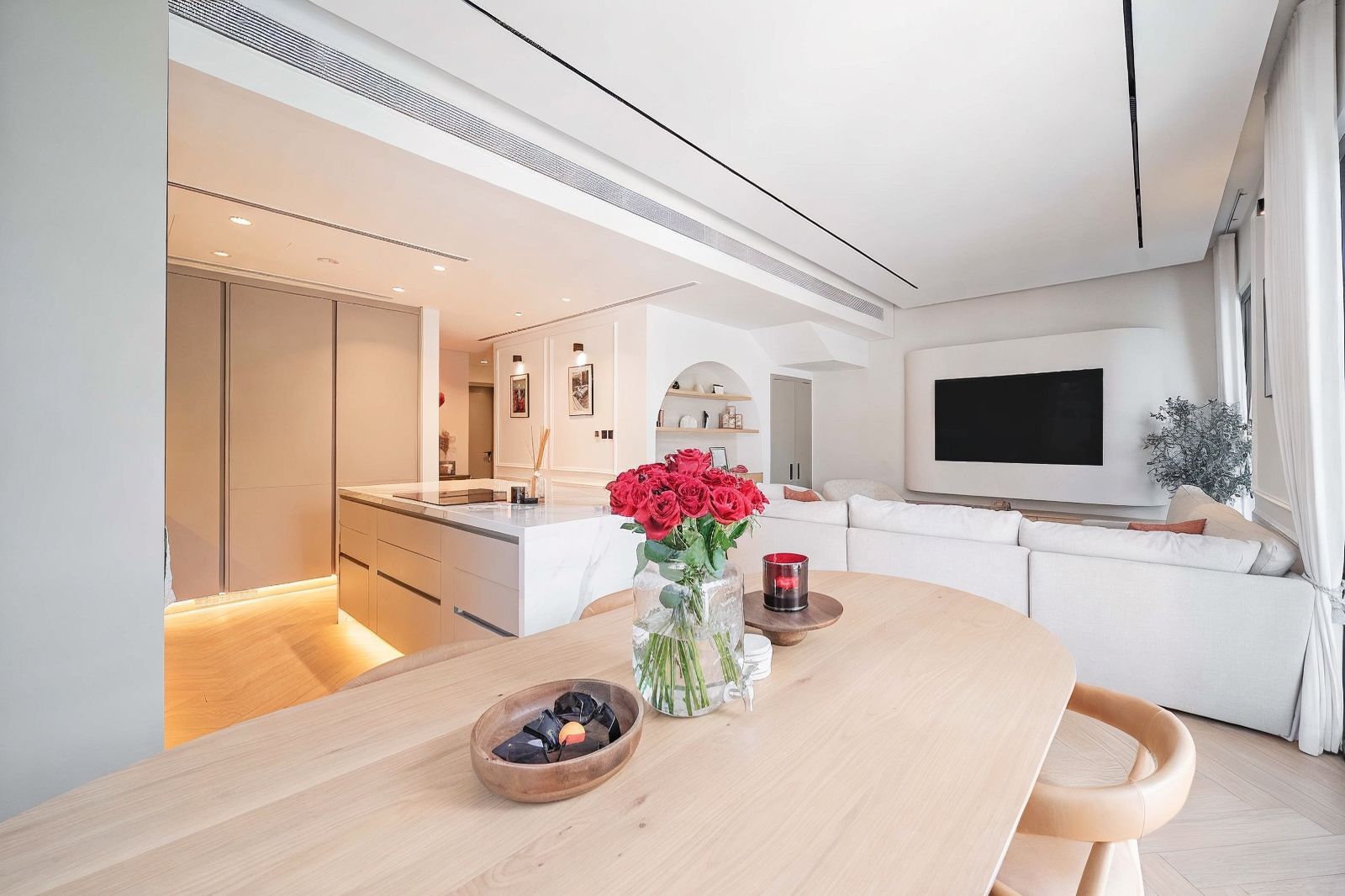 Open-plan dining with oval oak table