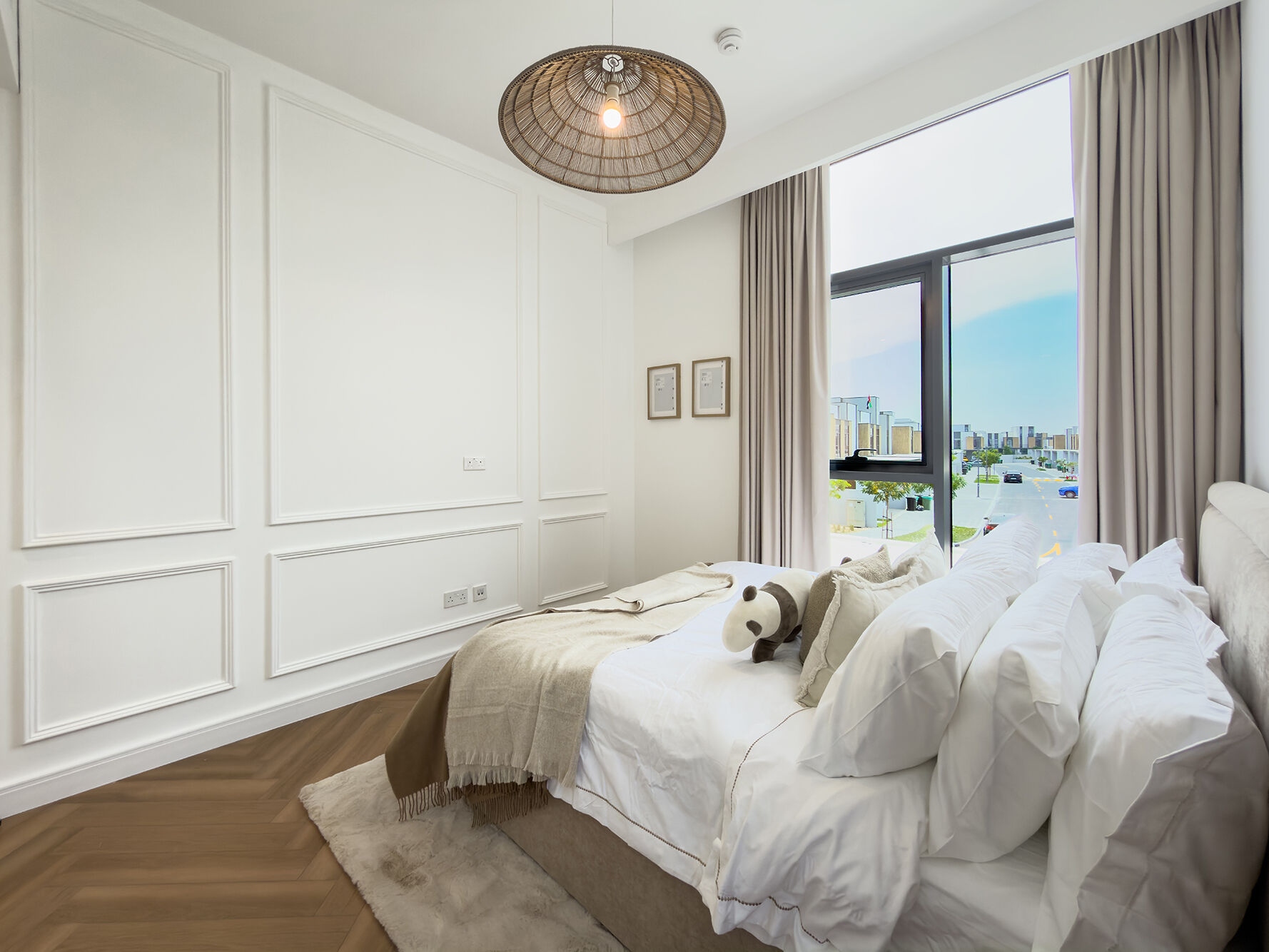Guest bedroom with rattan pendant