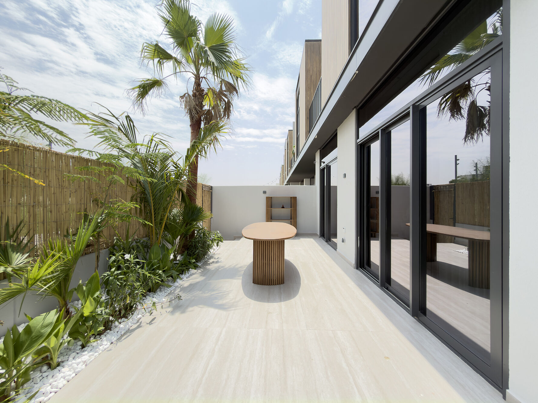 Side terrace with palms