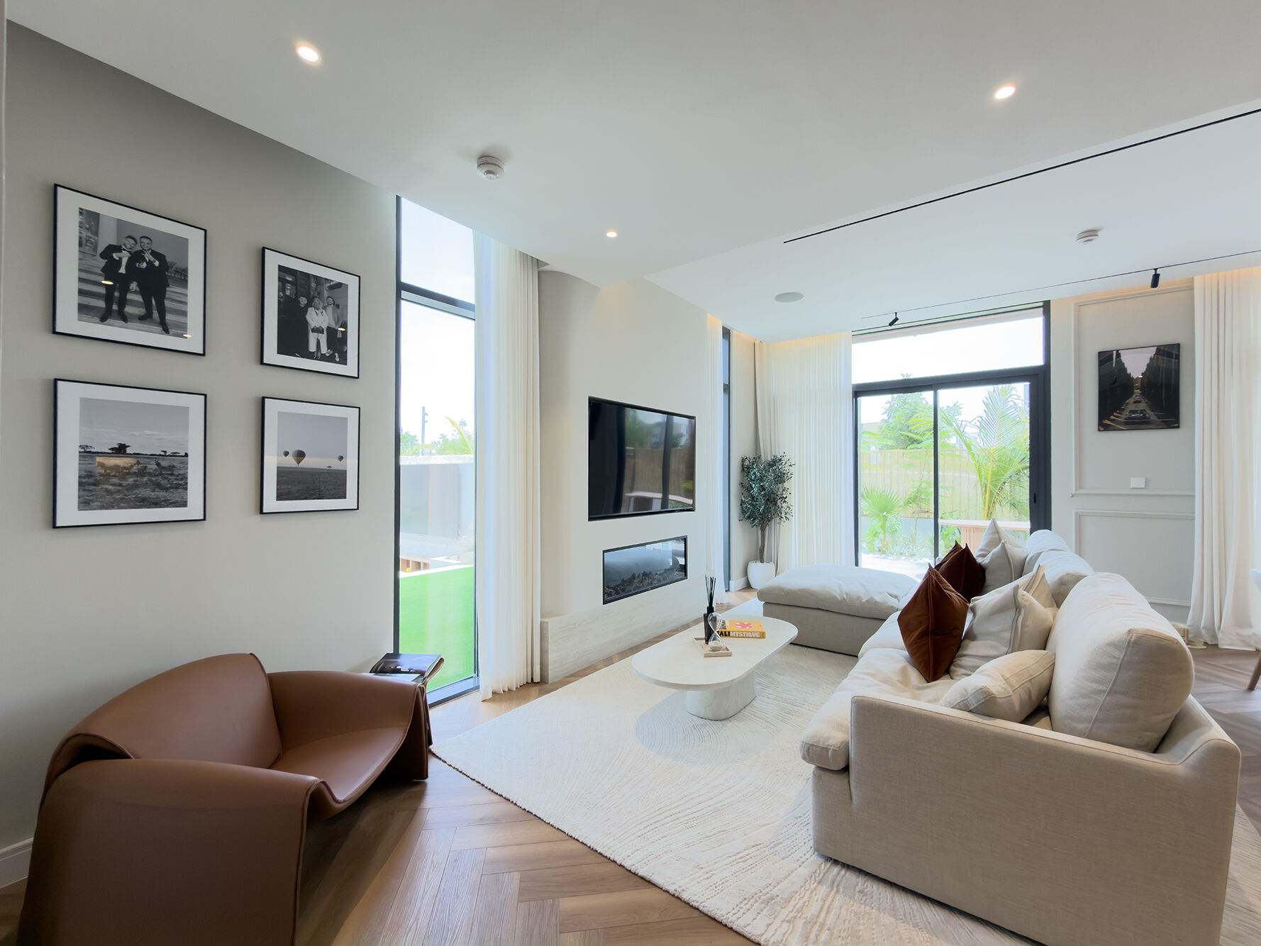 Living room with travertine fireplace and gallery wall